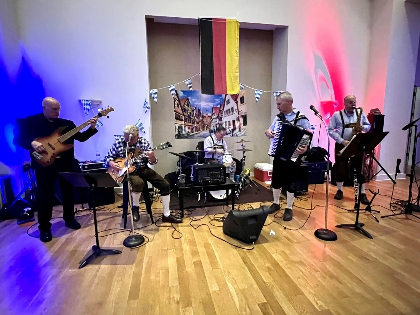 A group of people playing instruments in a room.