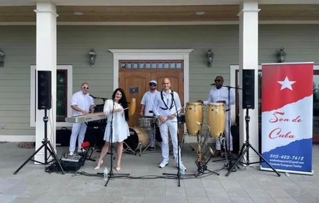 A group of people standing around with instruments.